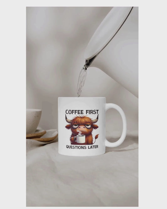 Coffee First Highland Cow Mug — Cute Funny "Coffee First, Questions Later" Ceramic Mug (11oz/15oz)